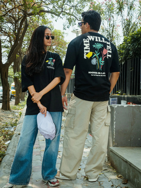 Women Oversized Black T-Shirt with “Time Will Tell” & Floral Graphic Print