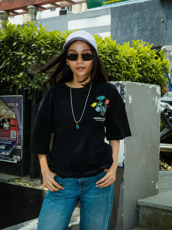 Women Oversized Black T-Shirt with “Time Will Tell” & Floral Graphic Print