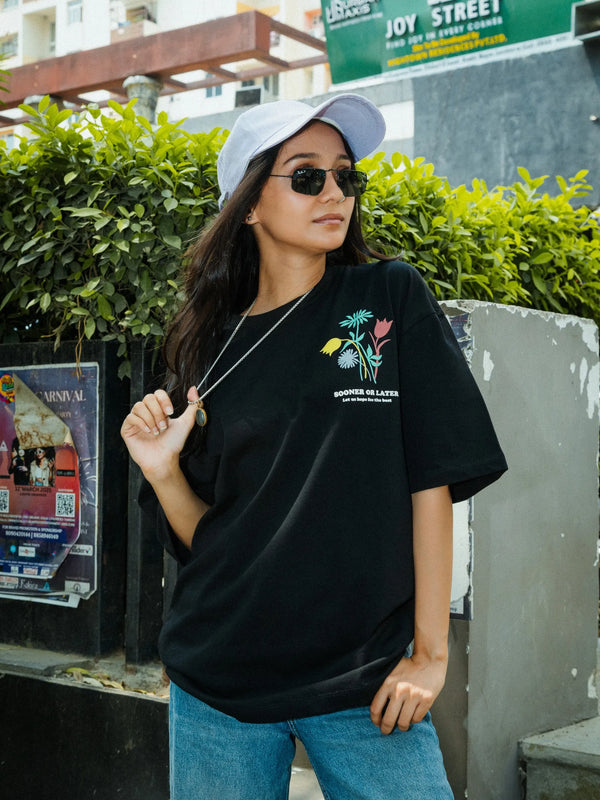 Women Oversized Black T-Shirt with “Time Will Tell” & Floral Graphic Print