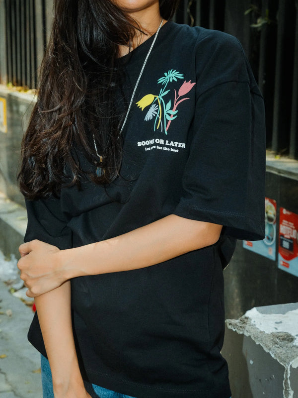 Women Oversized Black T-Shirt with “Time Will Tell” & Floral Graphic Print
