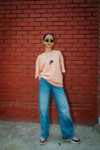 Women Oversized Peach Cotton T-Shirt with Back Cartoon Graphic