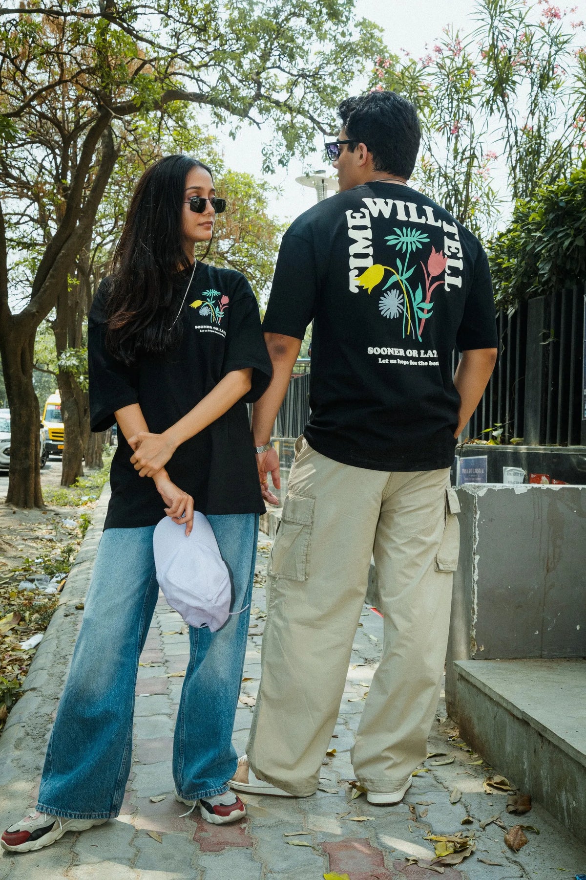 Women Oversized Black T-Shirt with “Time Will Tell” & Floral Graphic Print