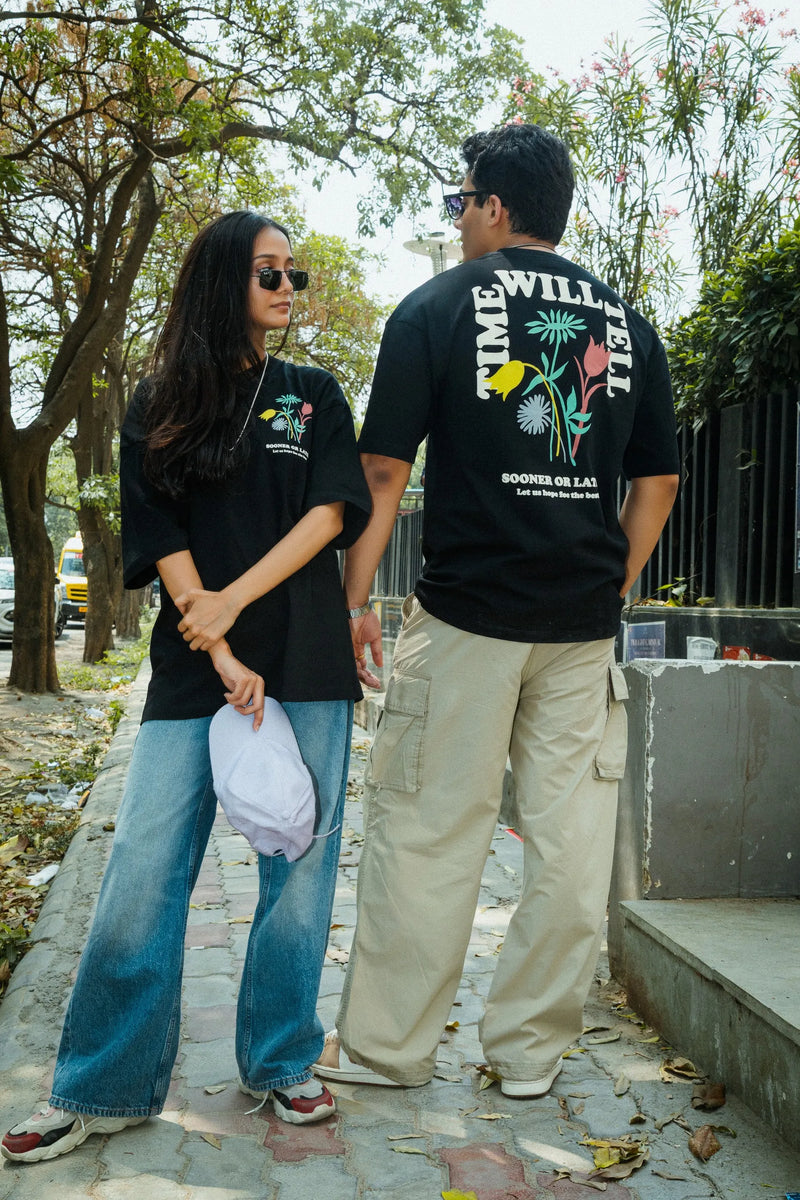Women Oversized Black T-Shirt with “Time Will Tell” & Floral Graphic Print