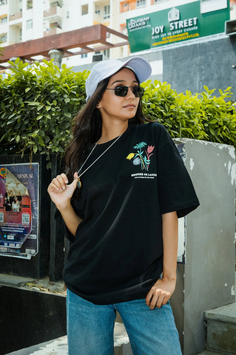 Women Oversized Black T-Shirt with “Time Will Tell” & Floral Graphic Print