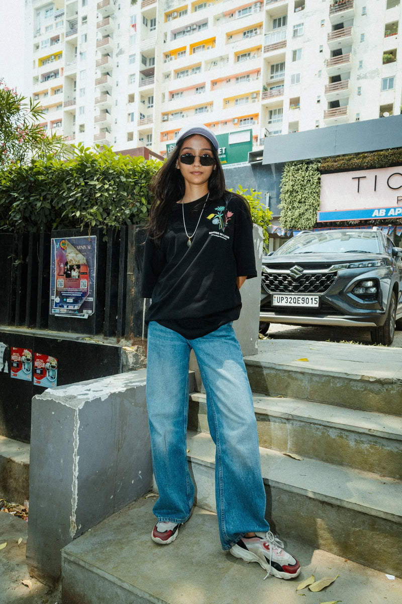 Women Oversized Black T-Shirt with “Time Will Tell” & Floral Graphic Print