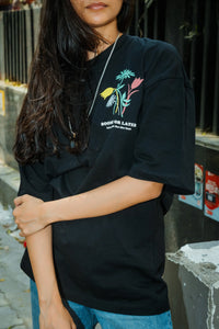 Women Oversized Black T-Shirt with “Time Will Tell” & Floral Graphic Print