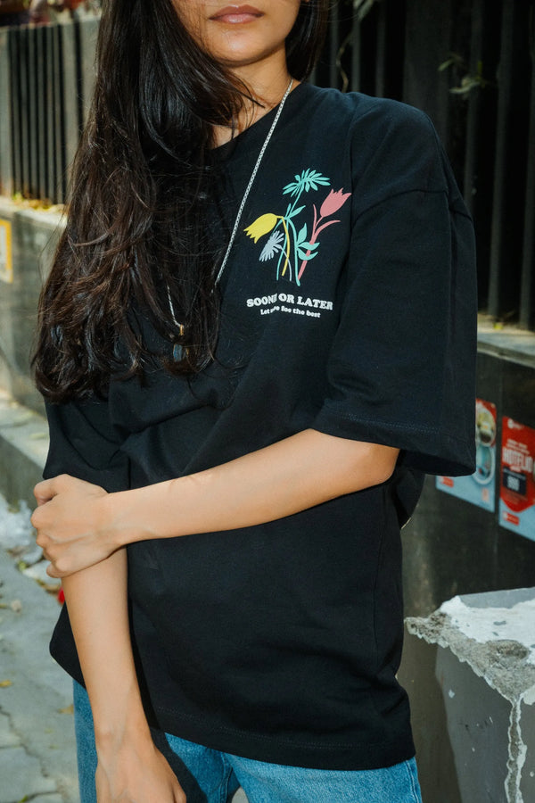 Women Oversized Black T-Shirt with “Time Will Tell” & Floral Graphic Print