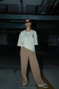 Women Oversized Off-White T-Shirt with Typographic Print