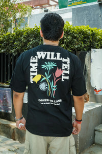 Unisex Oversized Black T-Shirt with “Time Will Tell” & Floral Graphic Print